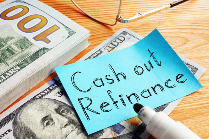 Pile of money with note that says "Cash Out Refinance"