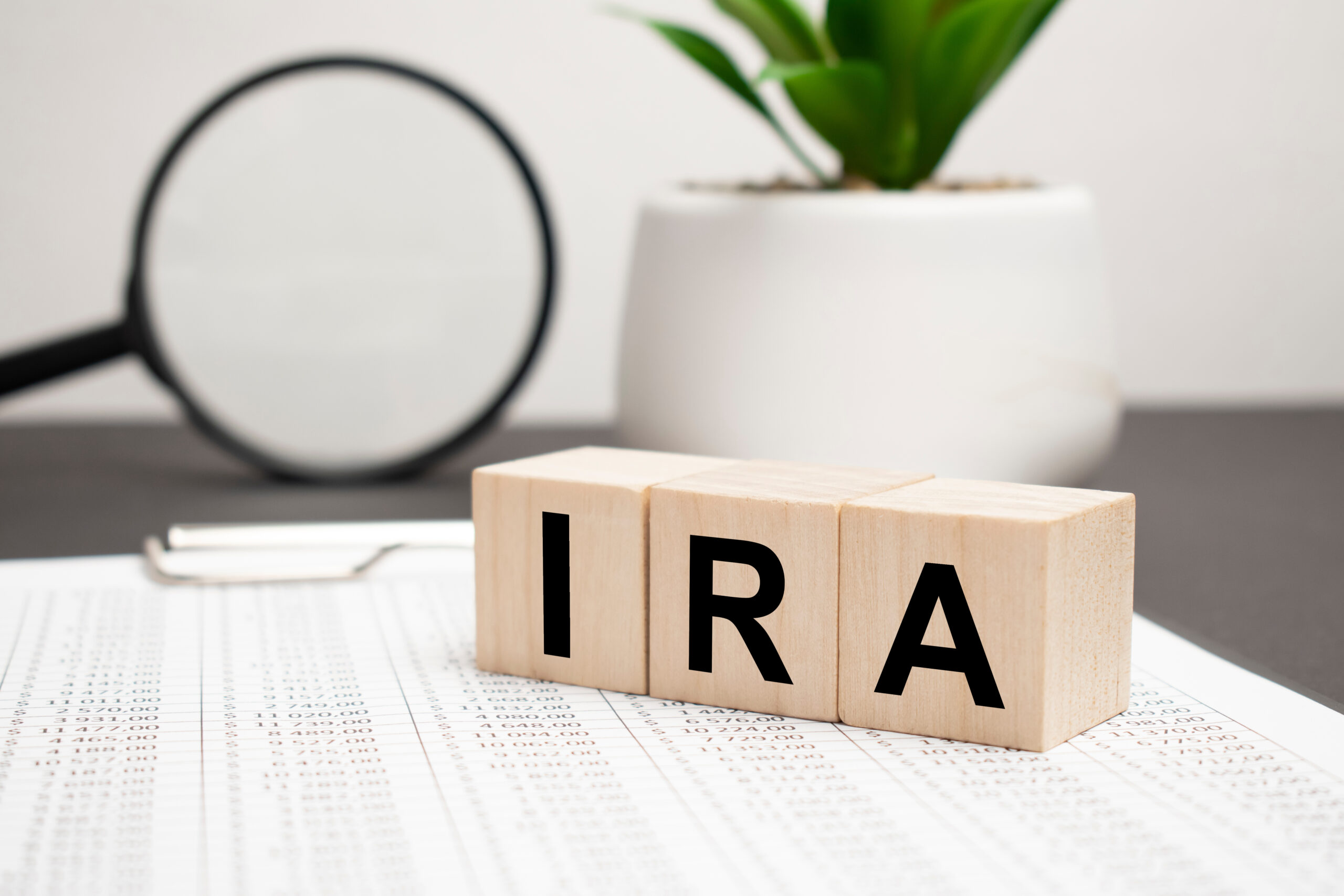 IRA individual retirement account word on wood cube block on a light background on the table
