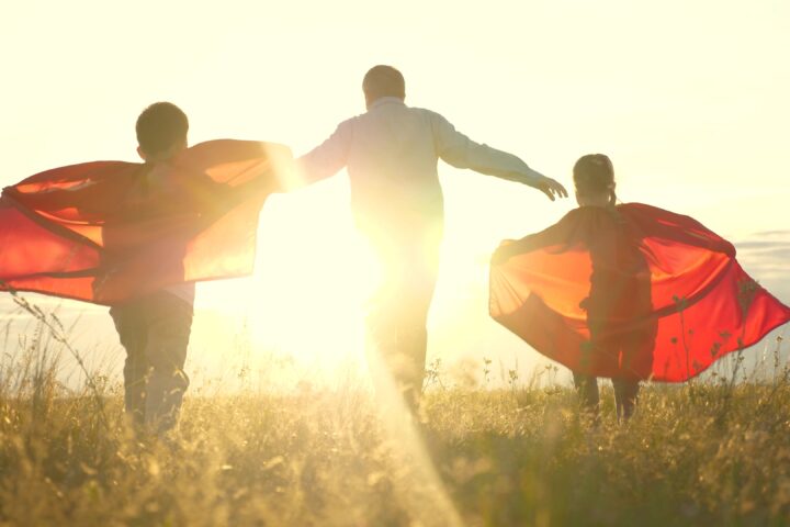 young boy father become superheroes nature playground chasing dreams experiencing power teamwork. power childhood dreams young boys girls play become superheroes nature playground. adventure now. joy childhood dreams young boy father become superheroes, playing park sunset. tale teamwork victory.