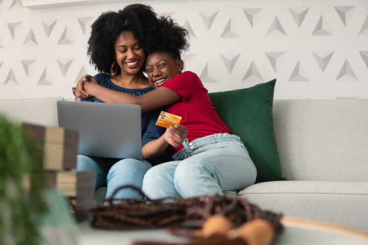 Teenager girl thanks mother for purchase in living room of house