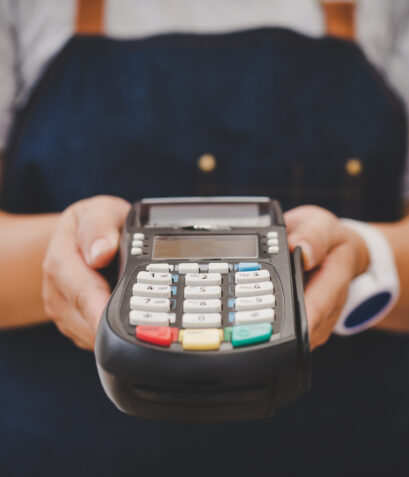 Paying by credit card , buying and selling products using a credit card swipe machine.