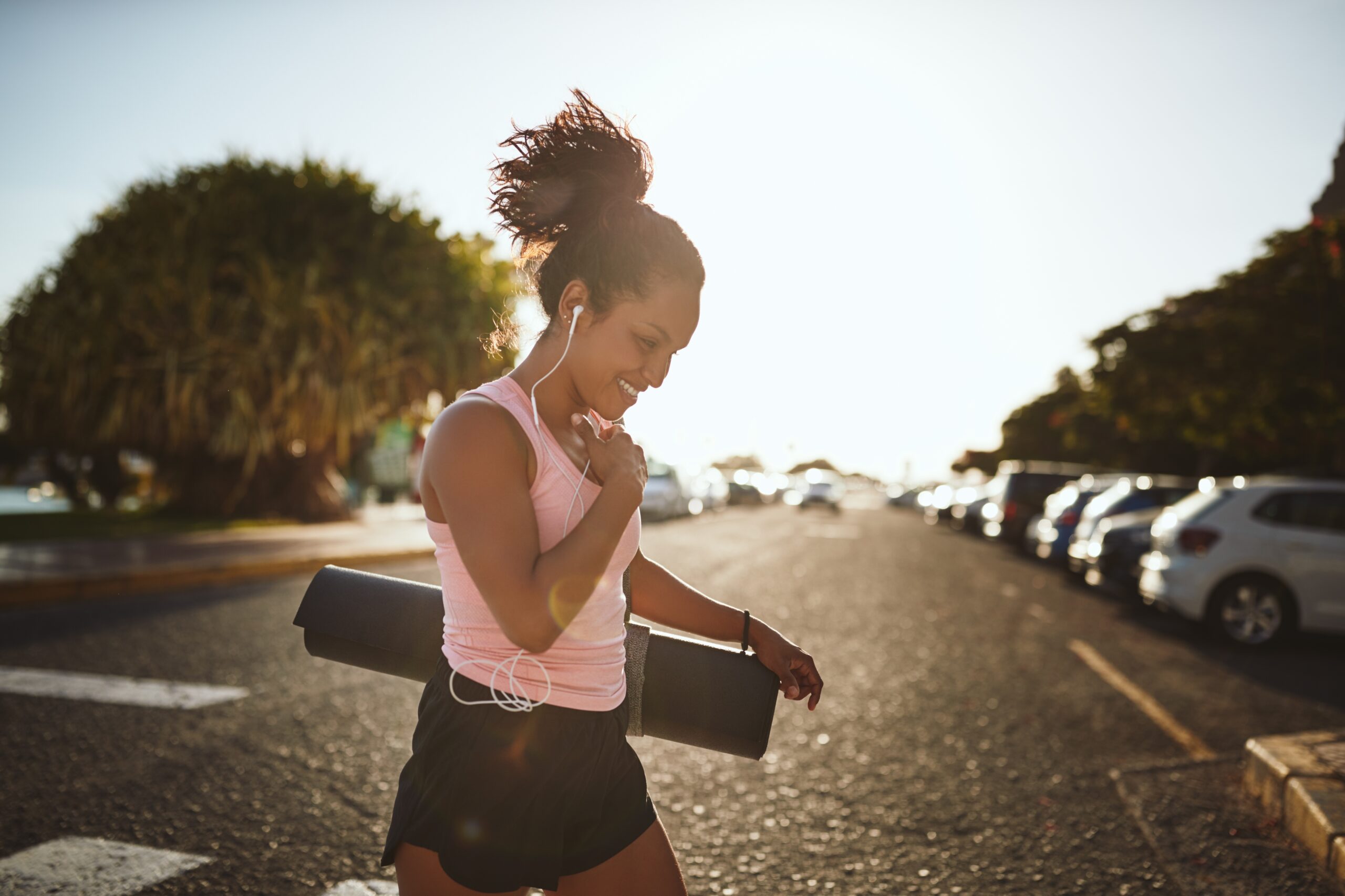 Smiling young woman working out.