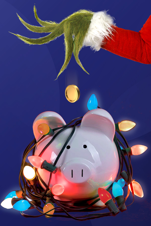 piggy bank wrapped in lights with the Grinch hand