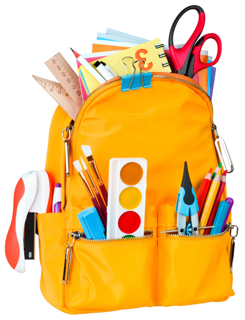 Yellow school backpack with school supplies isolated on white background