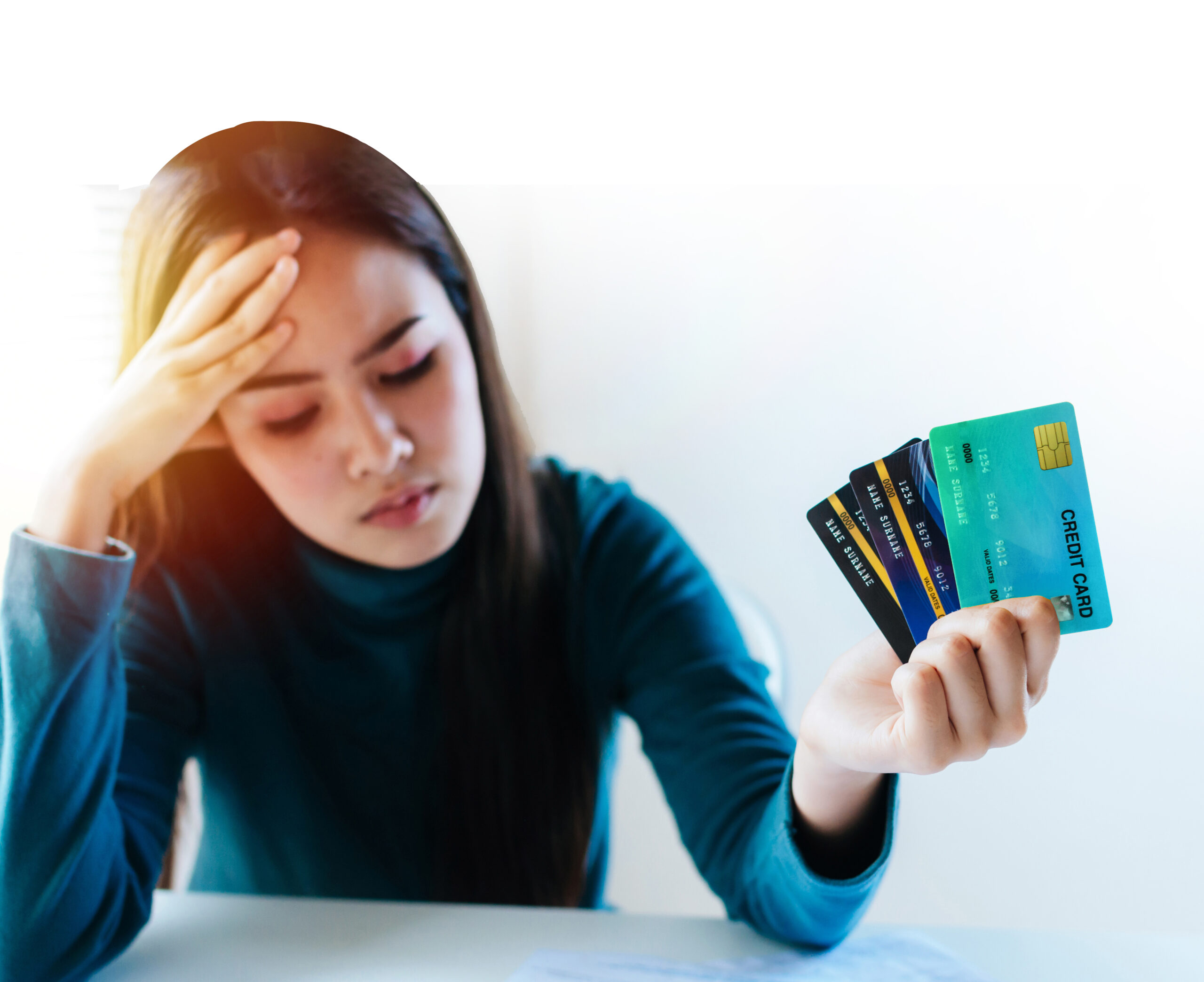 stressed young pretty woman headache holding many credit card in hand and worried about bill in home office, plan money cost saving, shopping online, investment, business finance and expenses concept