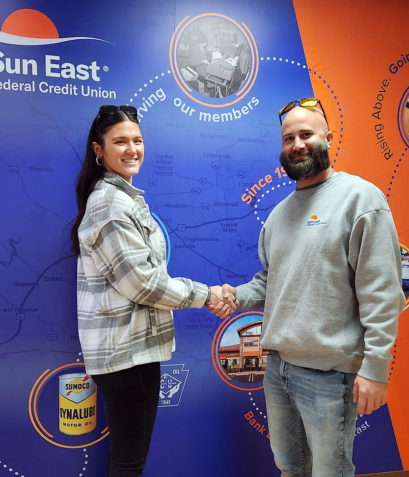 Jon and Meg in front of the Mural at the Aston Branch